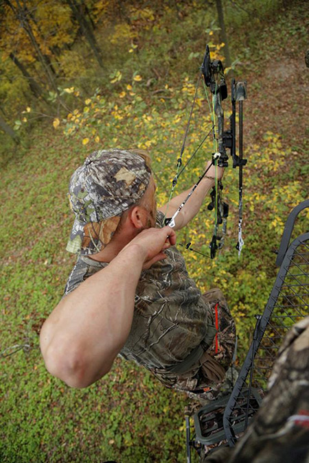 hunter standing on tree stand for hunting